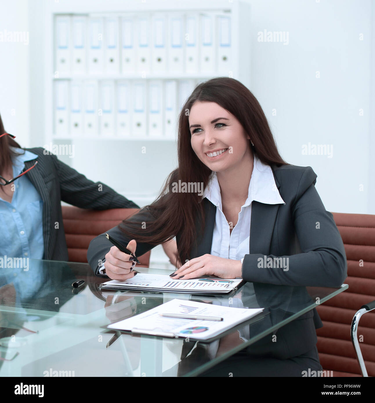 Three businesswomen meeting around table hi-res stock photography and ...