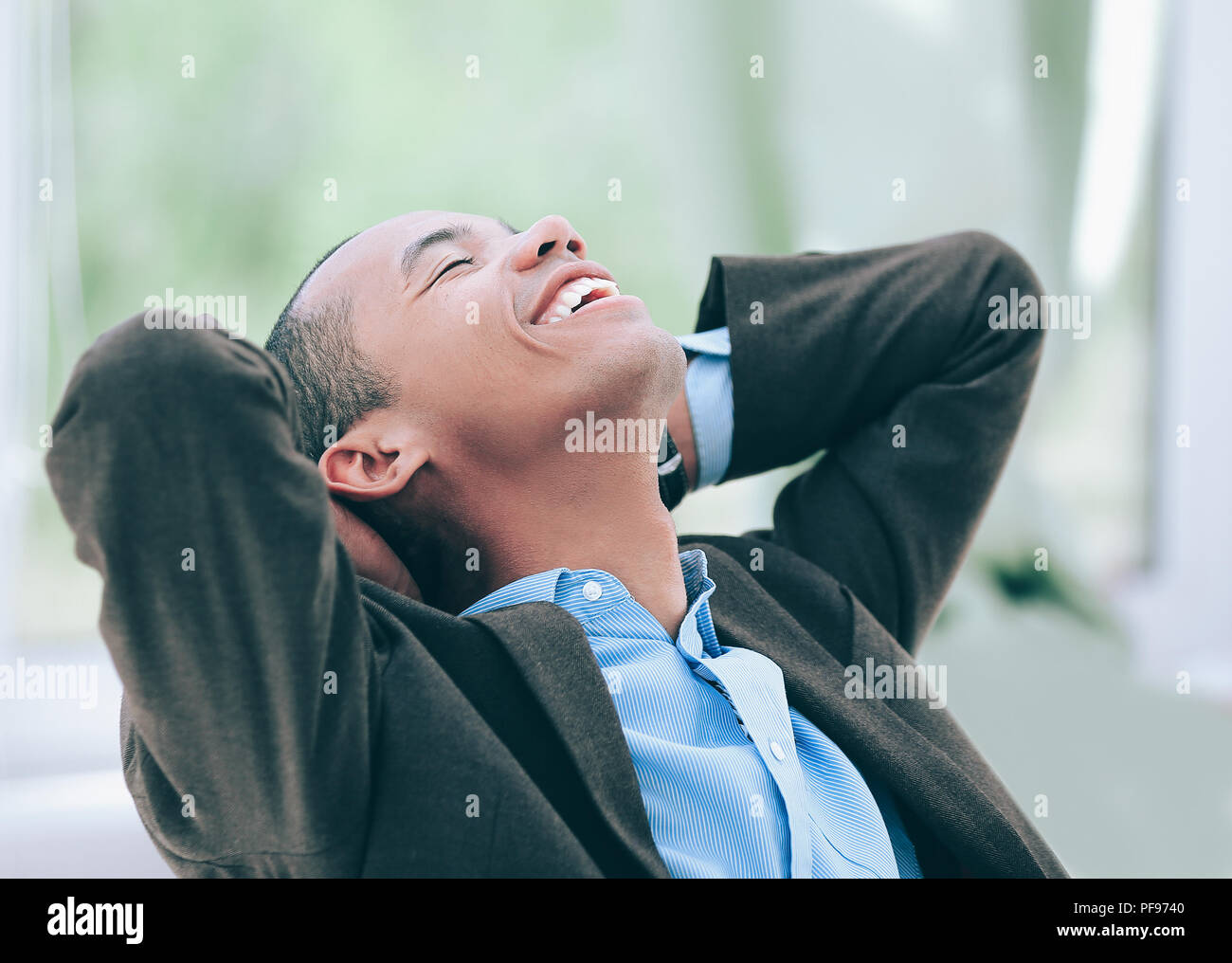 dreaming of a businessman sitting at his Desk Stock Photo Alamy