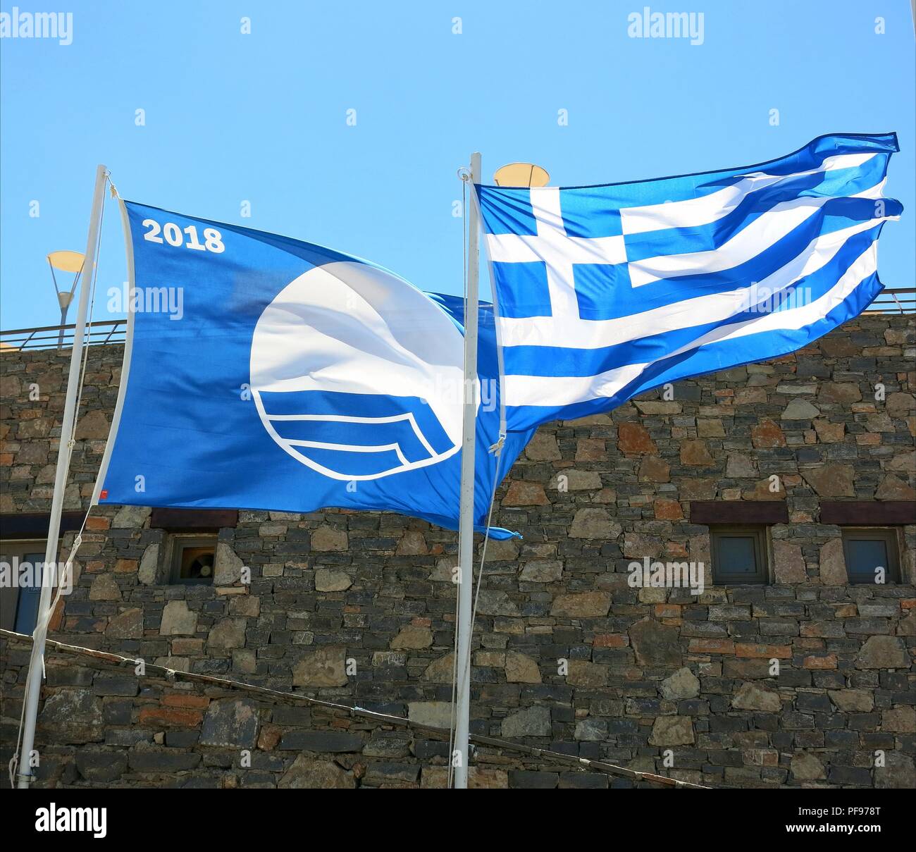 Blue and Greek flags Stock Photo Alamy