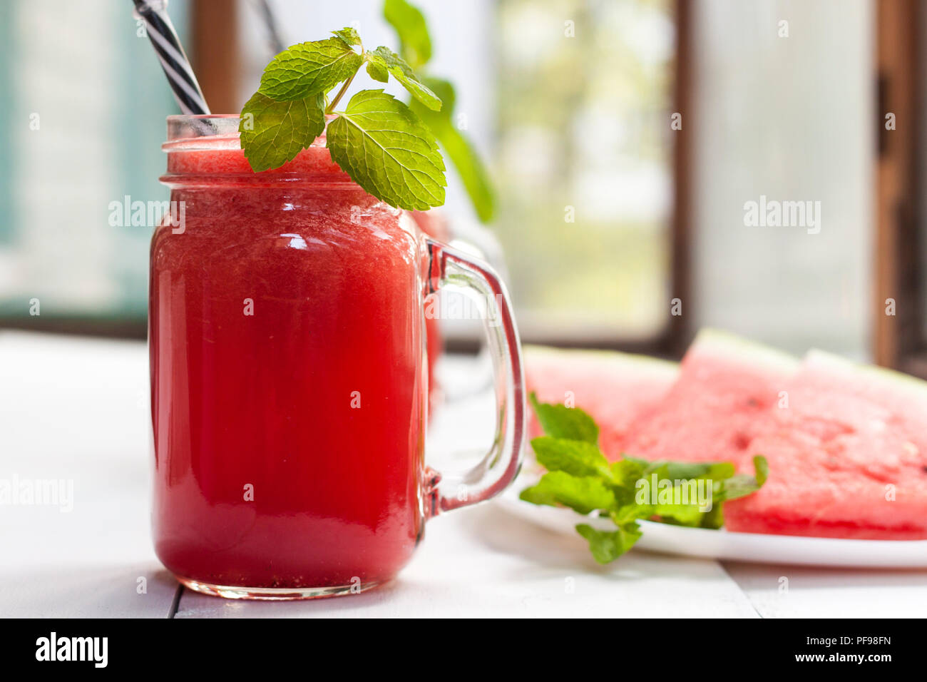 Tasty fresh appetizing watermelon drink smoothie. Watermelon drink in glass mugs Stock Photo