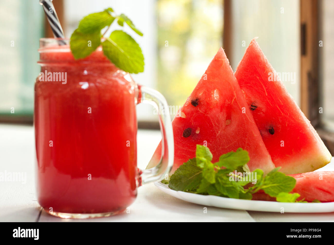 Tasty fresh appetizing watermelon drink smoothie. Watermelon drink in glass mugs Stock Photo