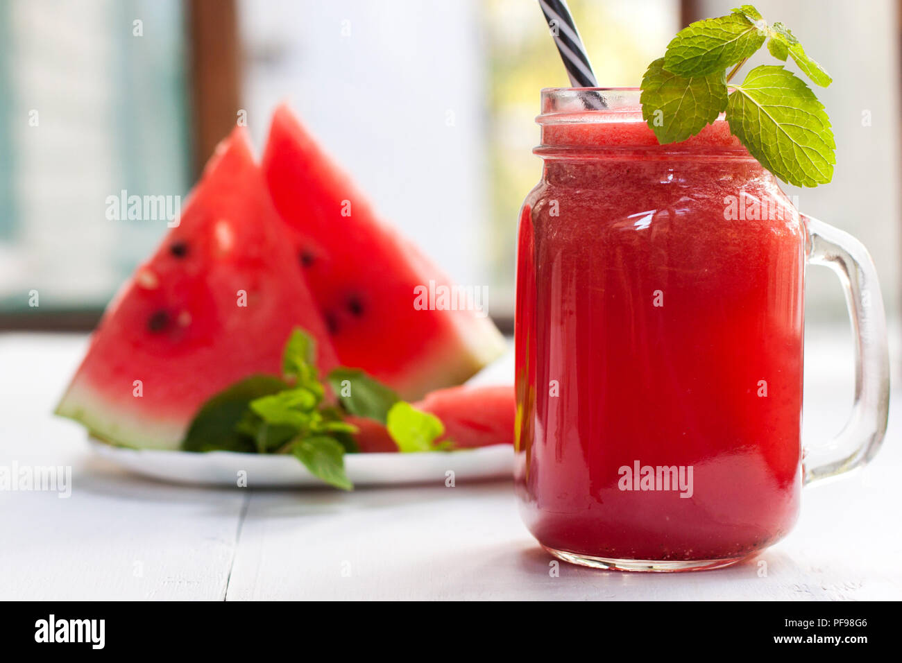 Tasty fresh appetizing watermelon drink smoothie. Watermelon drink in glass mugs Stock Photo