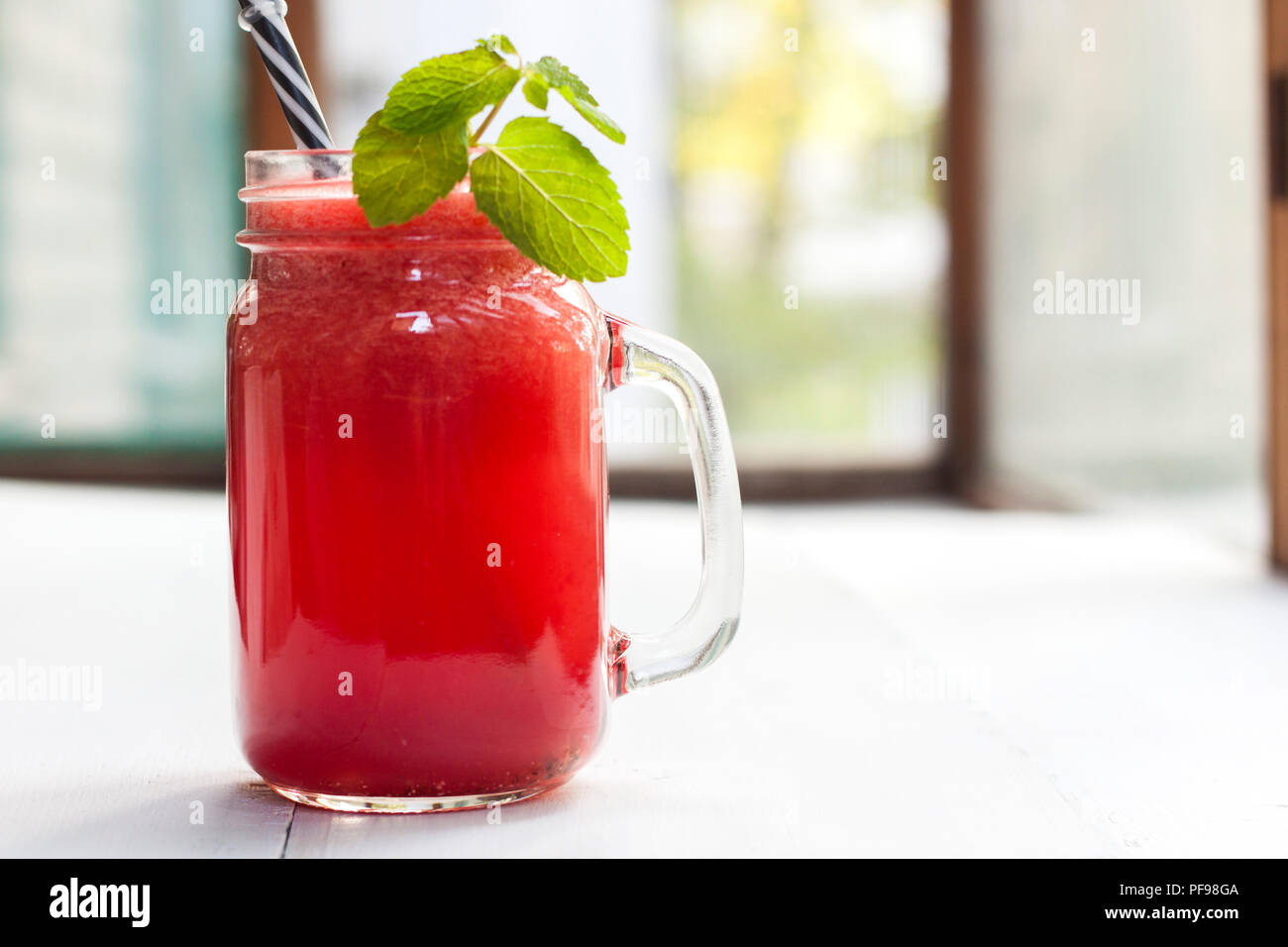 Tasty fresh appetizing watermelon drink smoothie. Watermelon drink in glass mugs Stock Photo