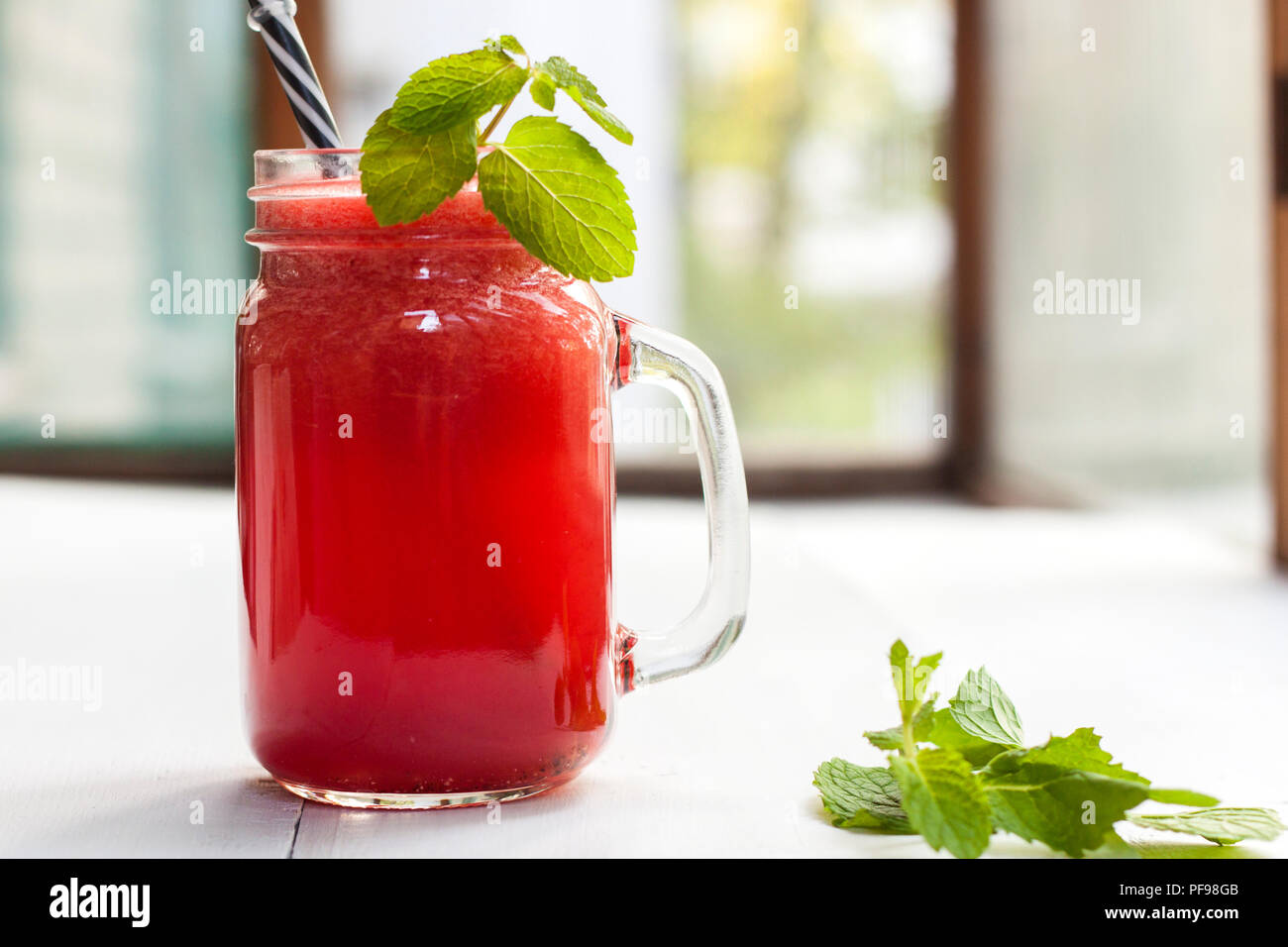 Tasty fresh appetizing watermelon drink smoothie. Watermelon drink in glass mugs Stock Photo