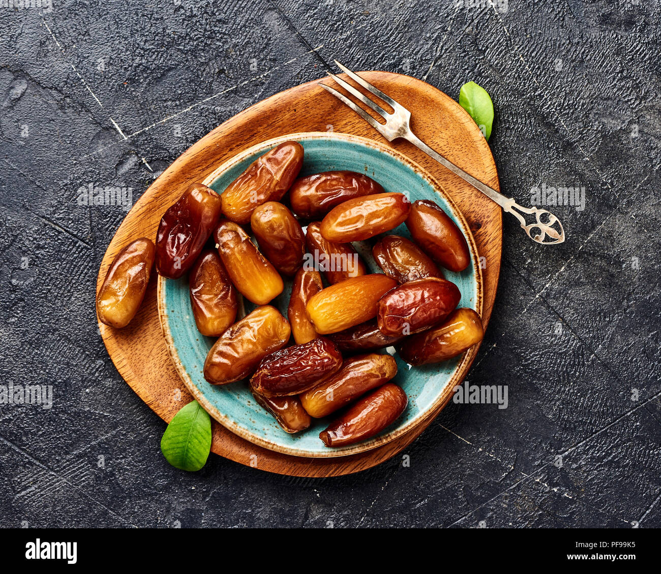 Dried dates fruits on plate. Top view of pitted dates Stock Photo Alamy