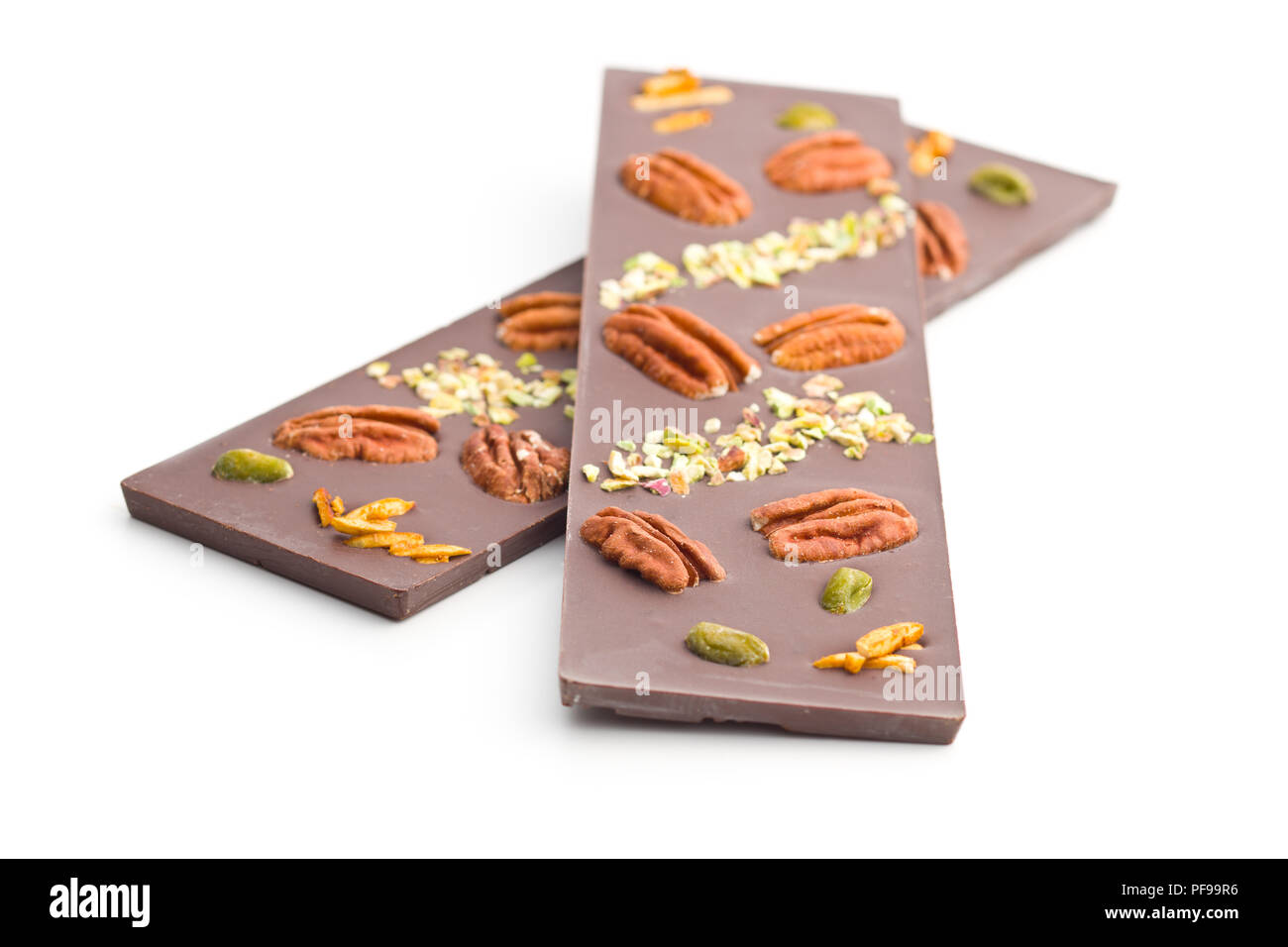 Chocolate bar with various nuts isolated on white background. Stock Photo