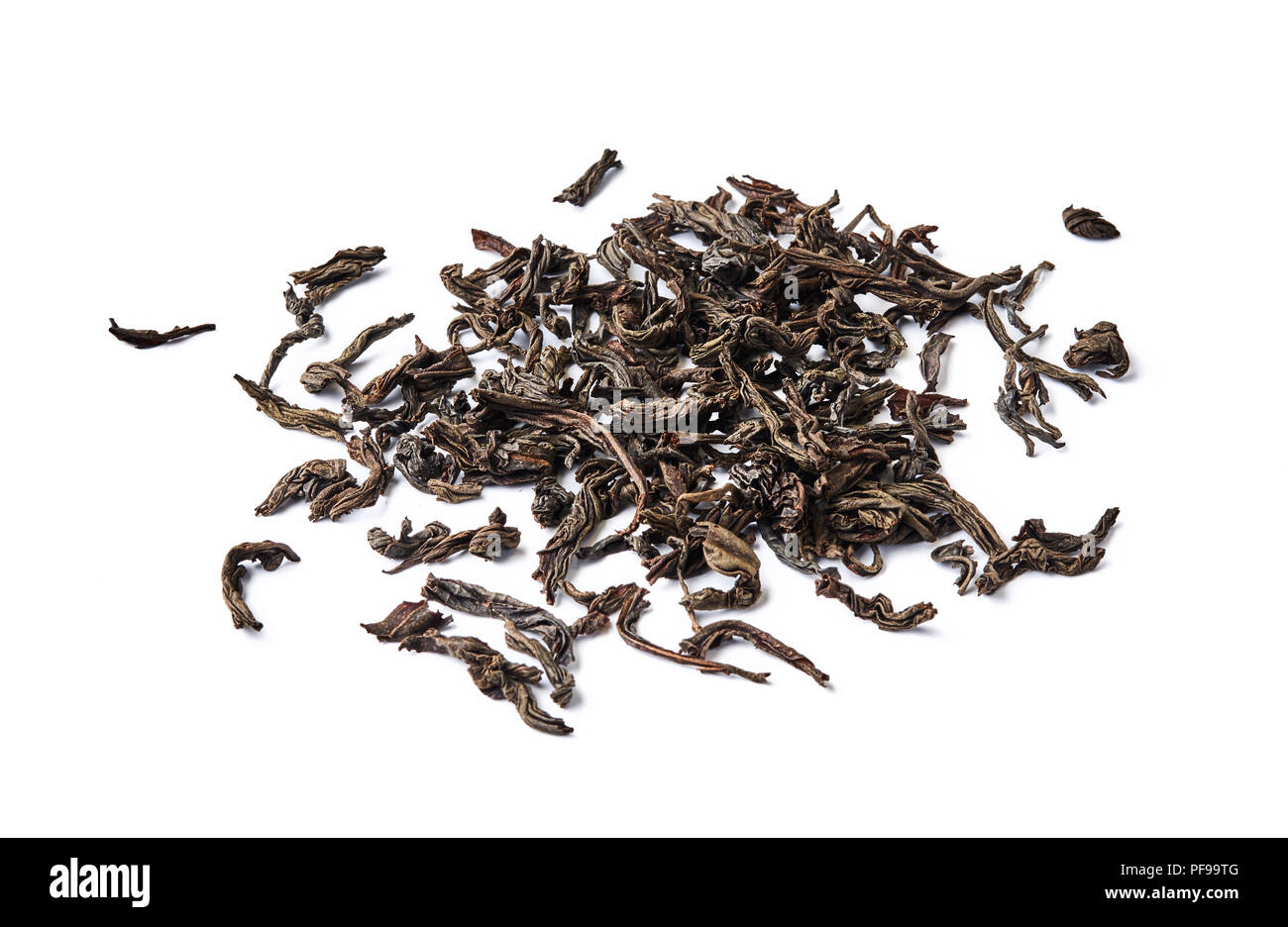 Heap of dried black tea leaves isolated on white background Stock Photo