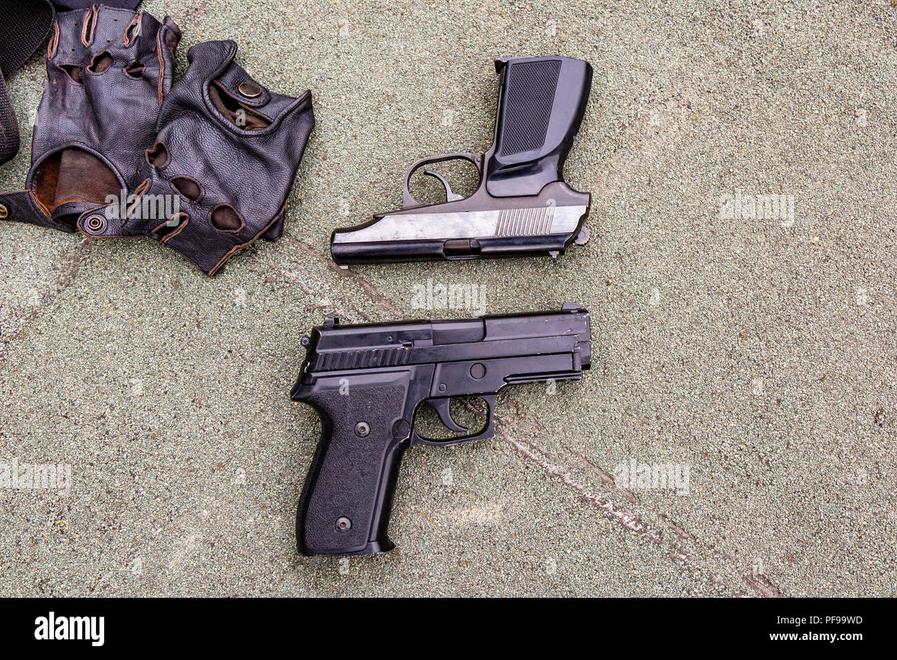 Weapons on the ground. Rifles pistols guns body armor Stock Photo Alamy