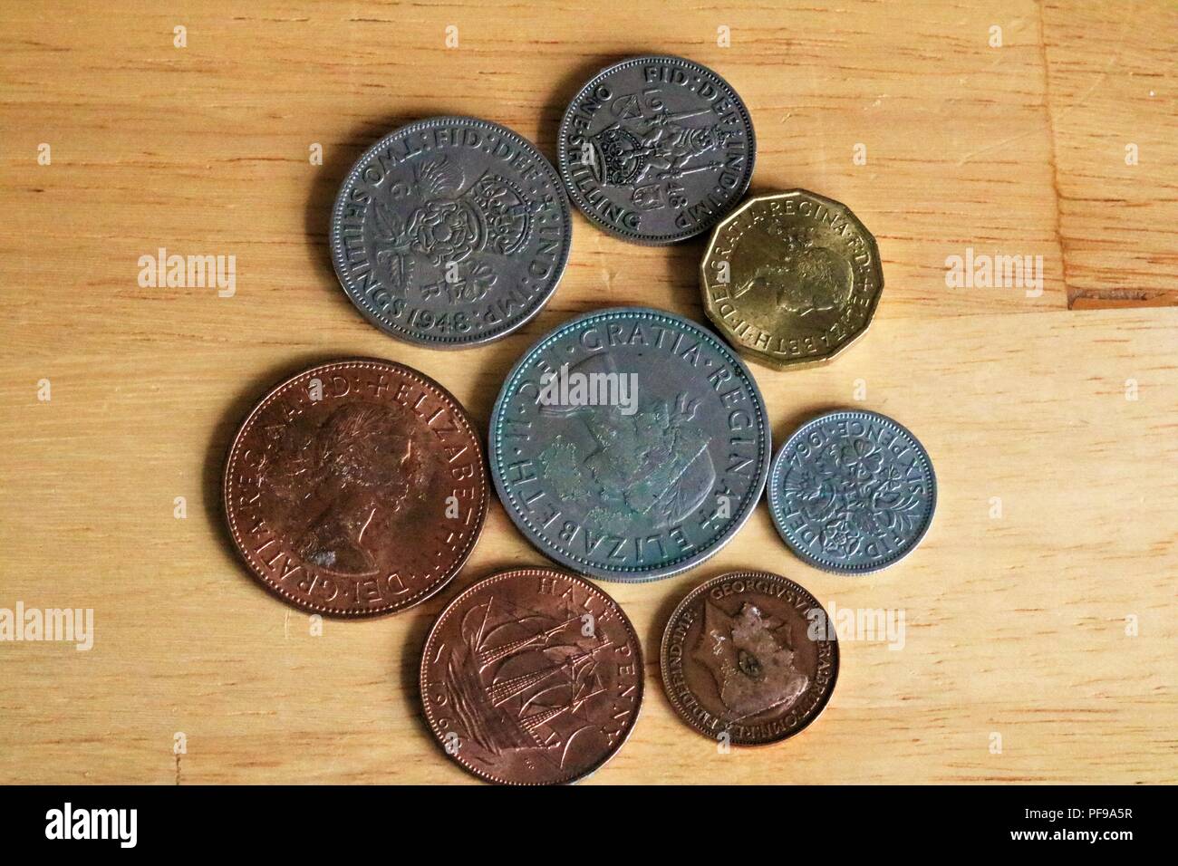 Pre-decimal currency in Britain (before 1971) - Shillings, six pence, half crown, three pence, half penny, farthing Stock Photo