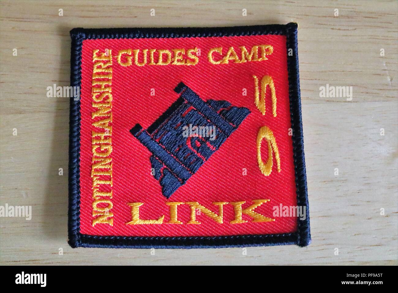 Nottinghamshire Guides Camp Link 95 red, yellow and blue fabric patch Stock Photo