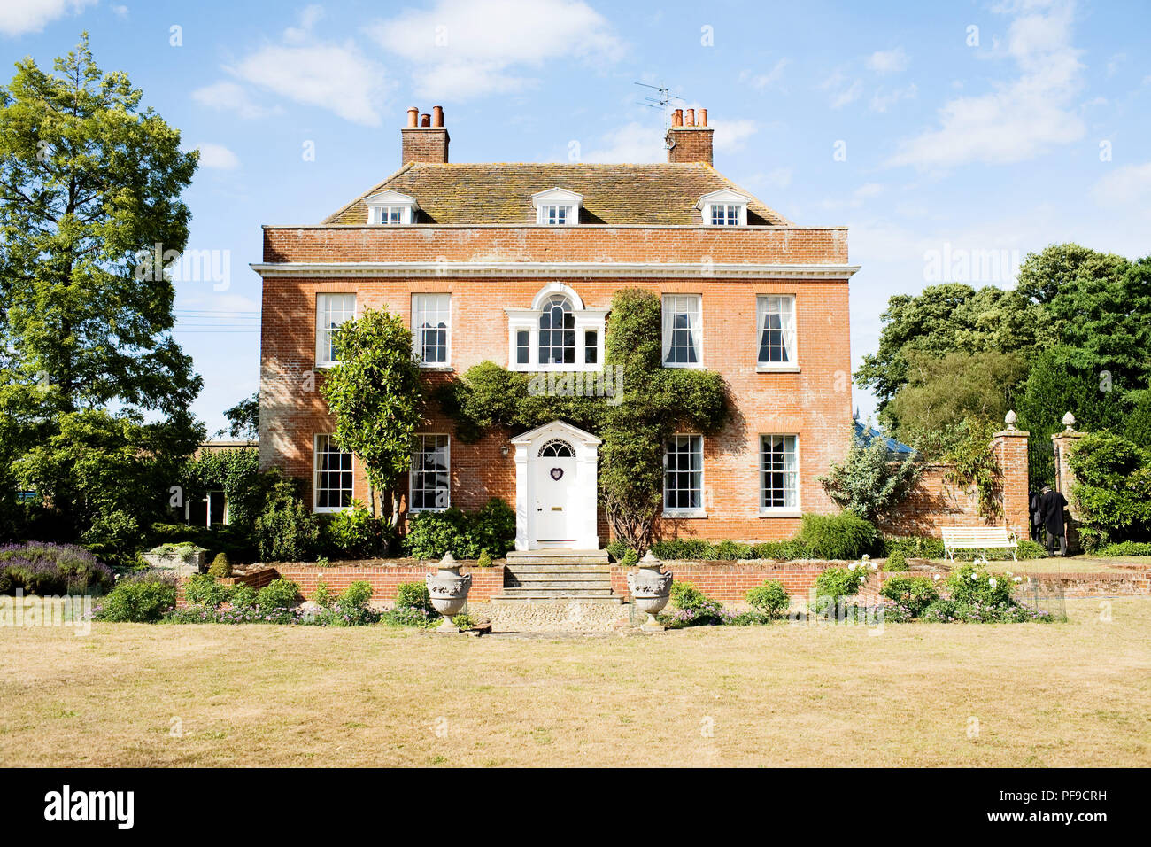 Georgian red brick symmetrical country house in england uk Stock Photo