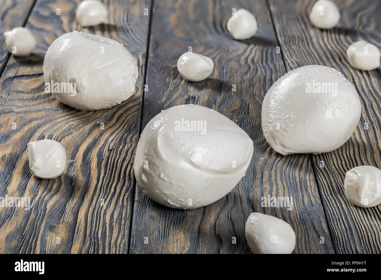 mozzarella balls on an old rustic table,  close-up Stock Photo