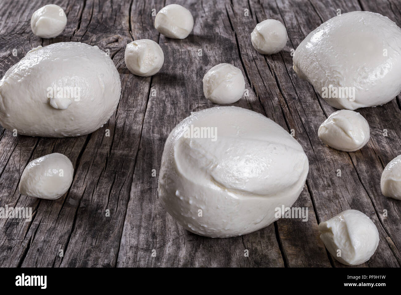 mozzarella balls on an old rustic table,  close-up Stock Photo