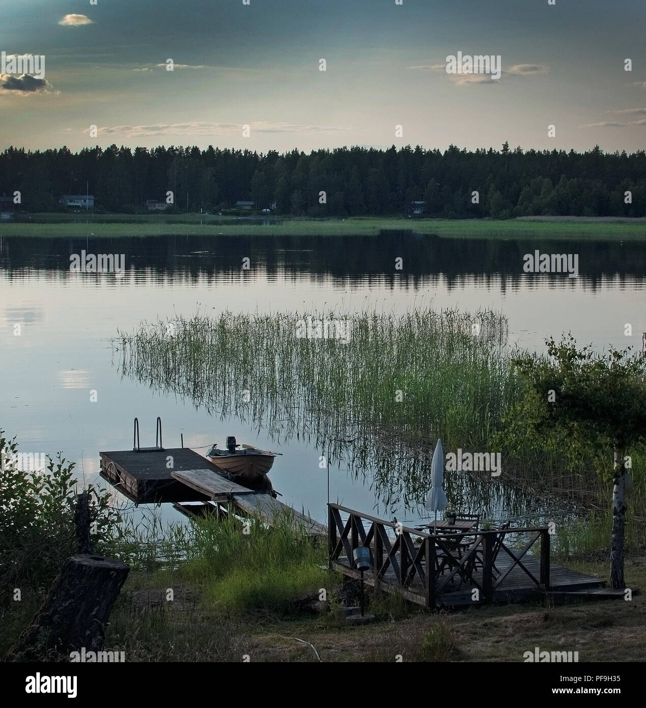 Summer sunset by the lake in Varmland Sweden tranquil water surface Stock Photo