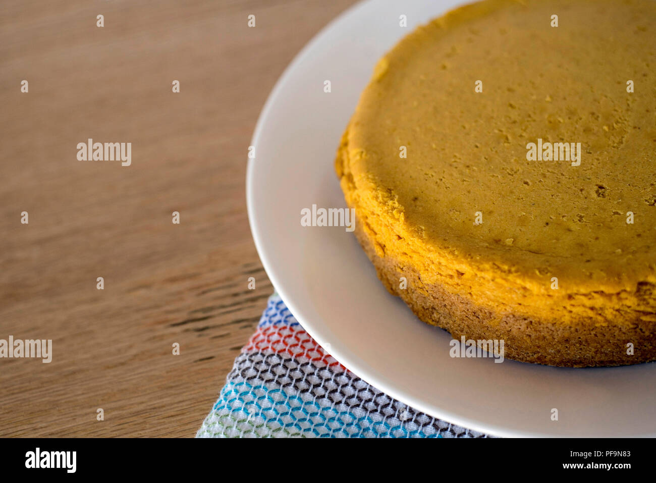 a Pumpkin Cheesecake Waiting to be Served for Dessert Stock Photo