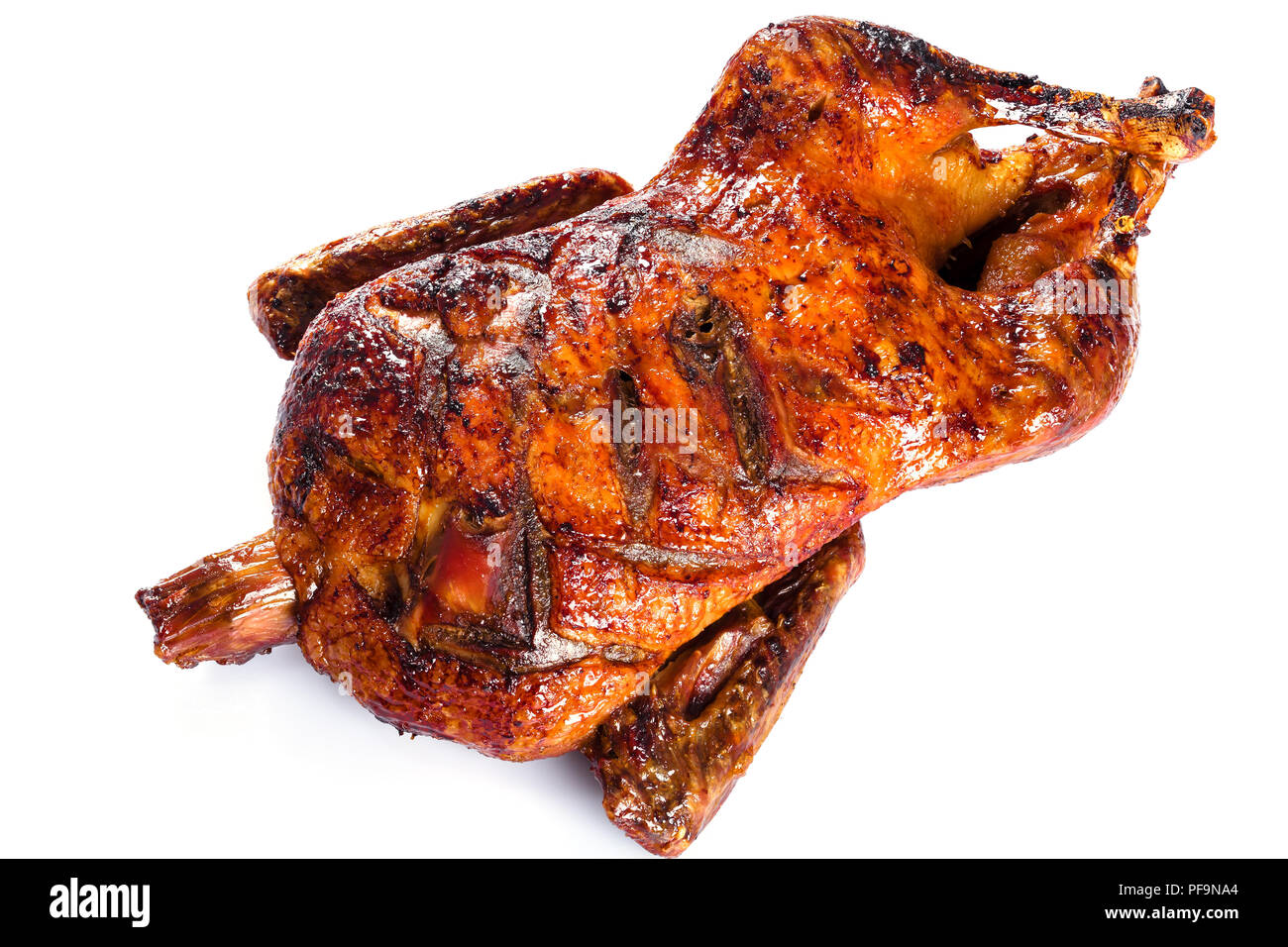 Roasted Whole Duck in honey mustard soy glaze on a white background