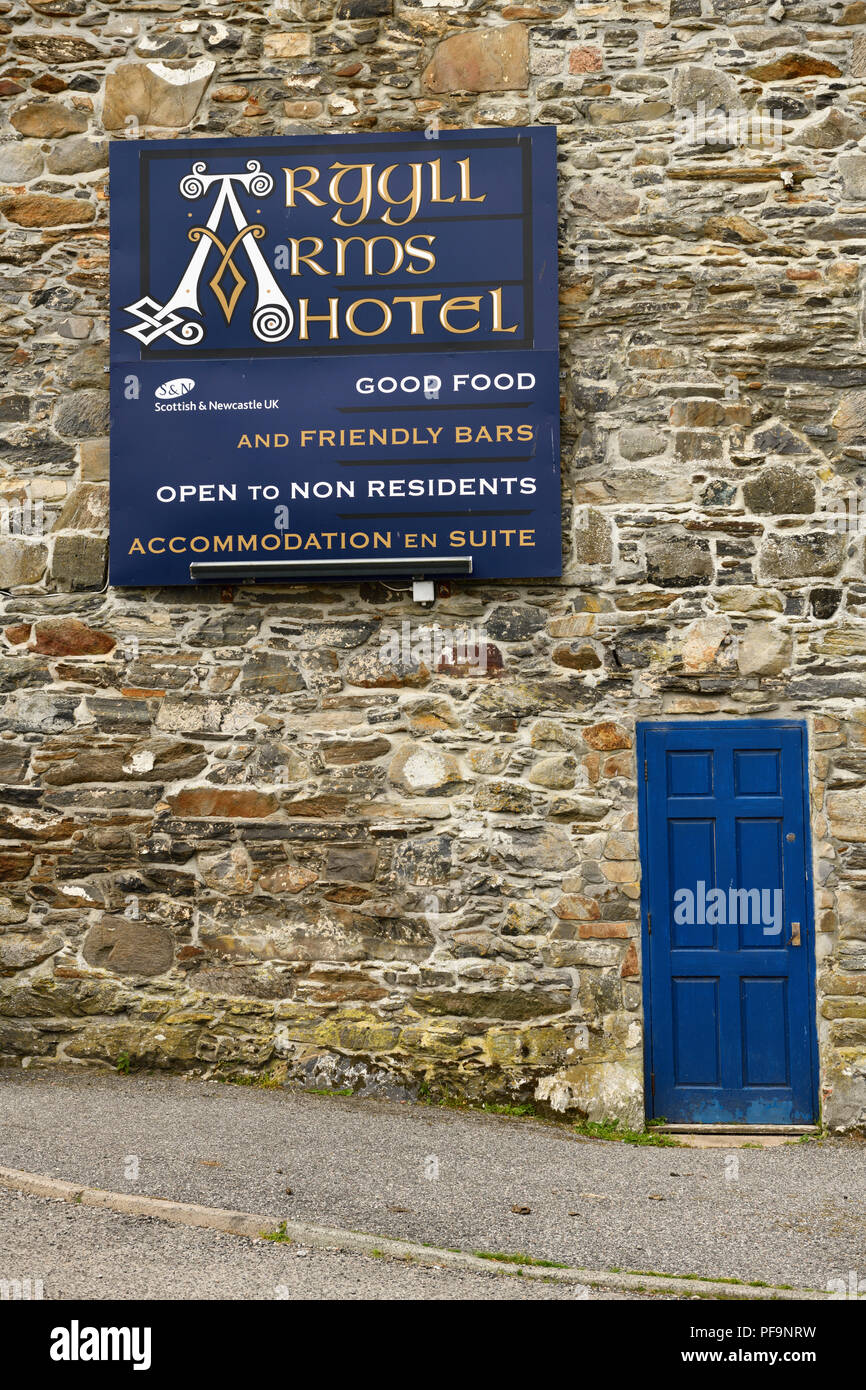 Stone wall of Argyll Arms Hotel with blue sign open to non residents in Bunessan on Isle of Mull Scotland UK Stock Photo