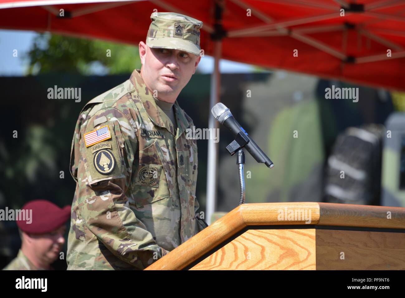 The 44th Expeditionary Signal Battalion incoming Command Sgt Maj Sean P Mitcham delivers a speech during the battalion's change of responsibility ceremony at Tower Barracks, Grafenwoehr, Germany, July 27, 2018. Image courtesy Gertrud Zach/Training Support Activity Europe. () Stock Photo