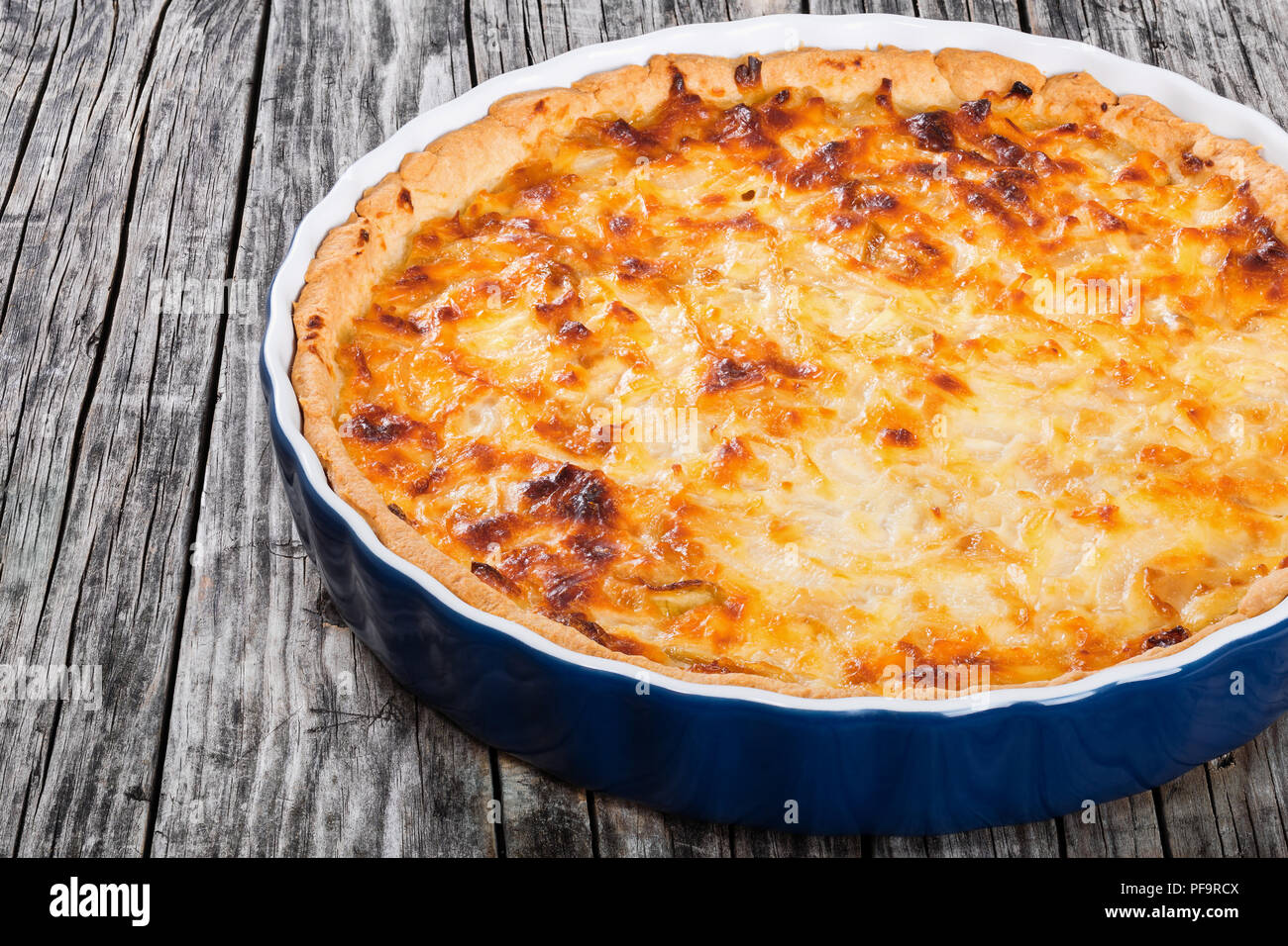 French onion quiche  or pie in a gratin dish, traditional recipe, view from above Stock Photo