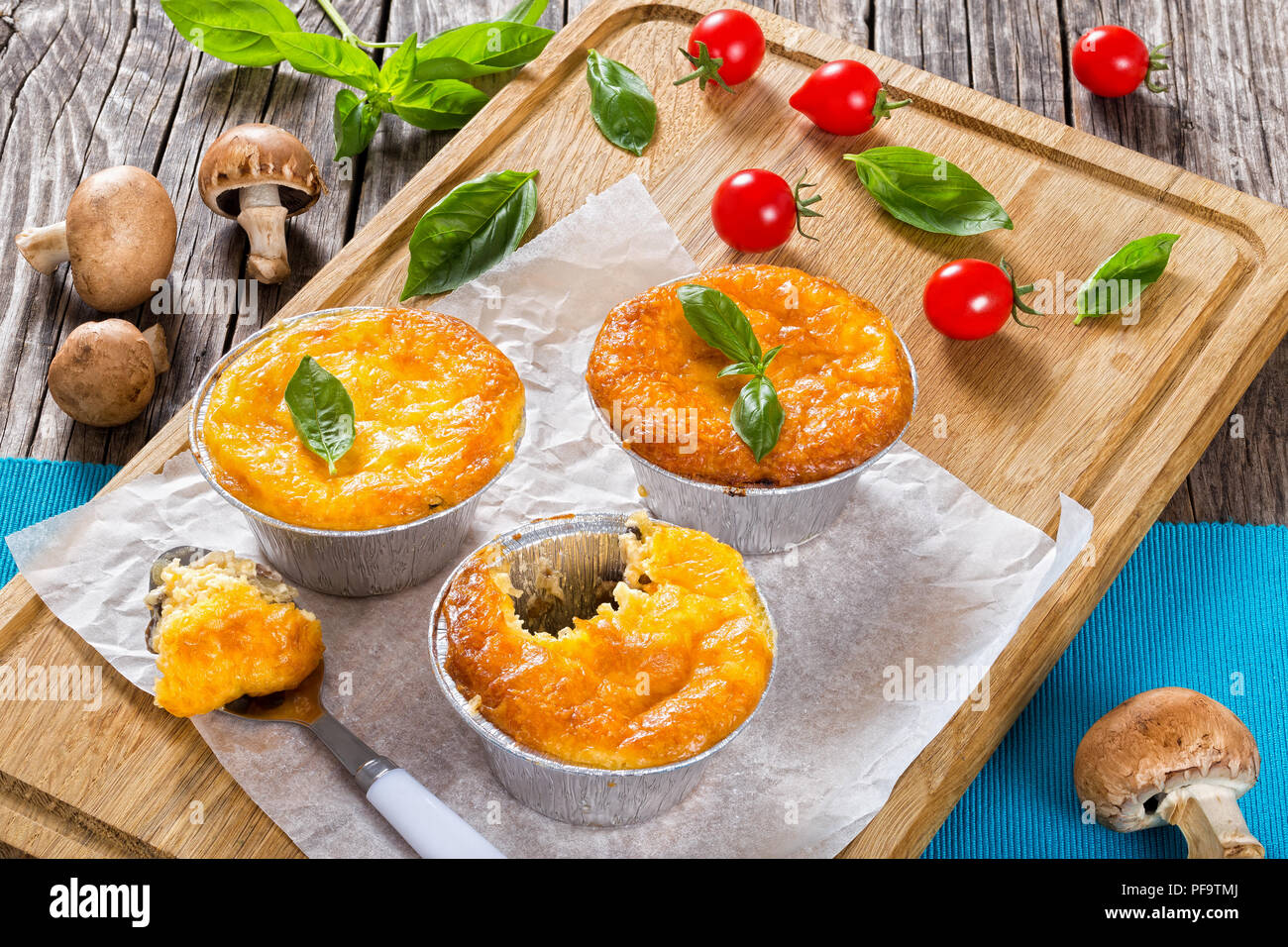 French cuisine julienne. Mushroom, chicken and cheese gratin in Mini