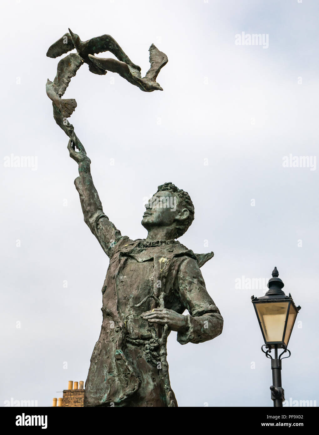 Statue of John Muir as a boy marks Eastern end of John Muir Way, walking and cycling trail, Dunbar, East Lothian, Scotland, UK Stock Photo