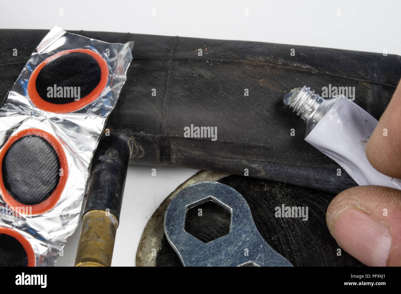 Bicycle tube, glue and patches in the Repairing a damaged