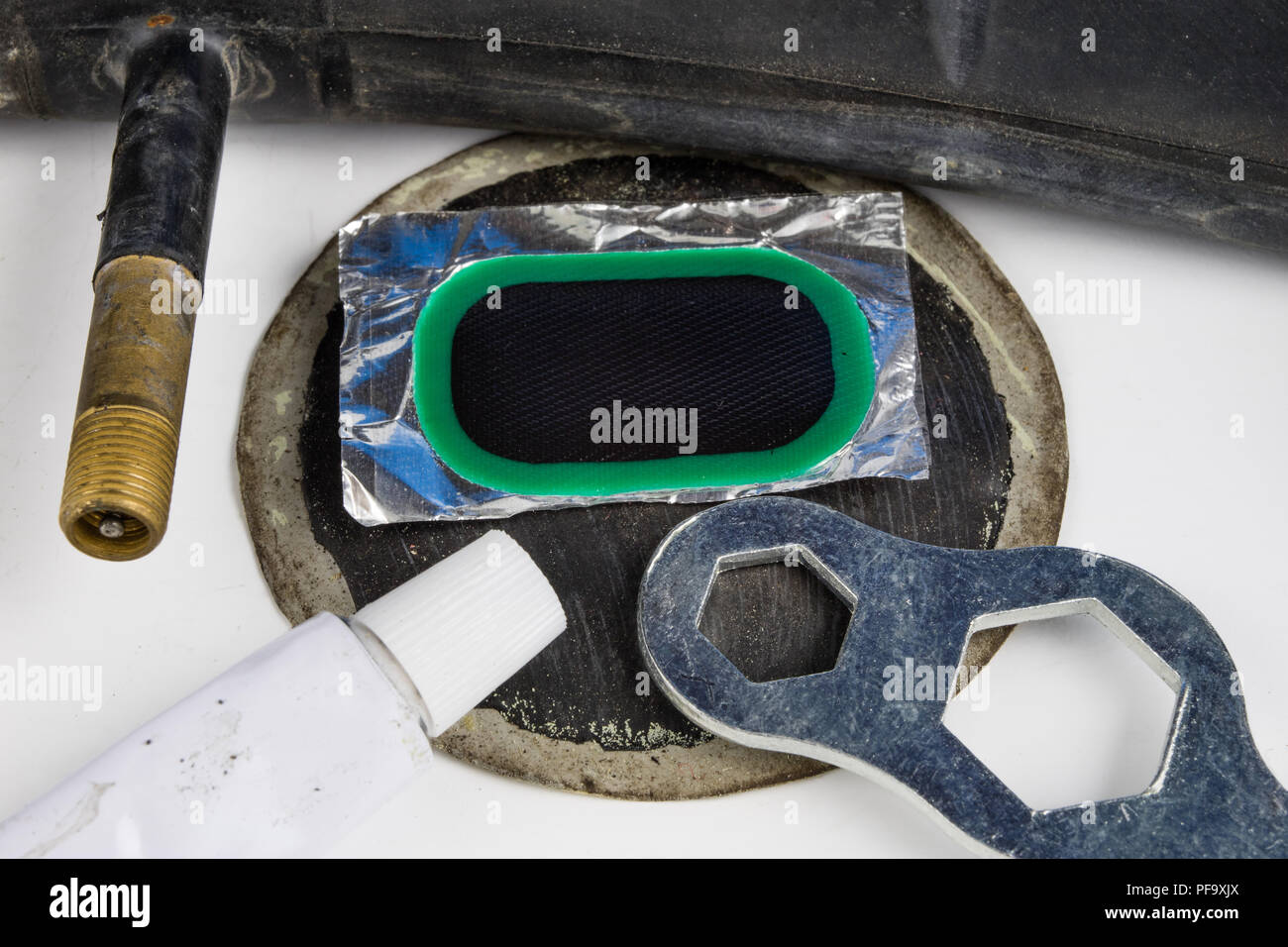 Bicycle tube, glue and patches in the Repairing a damaged