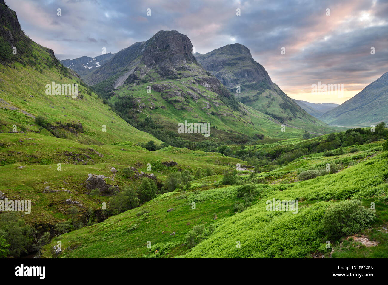 The Three Sisters peaks of Glen Coe with snow capped Bidean nam Bian and River Coe Scottish Highlands Scotland UK Stock Photo