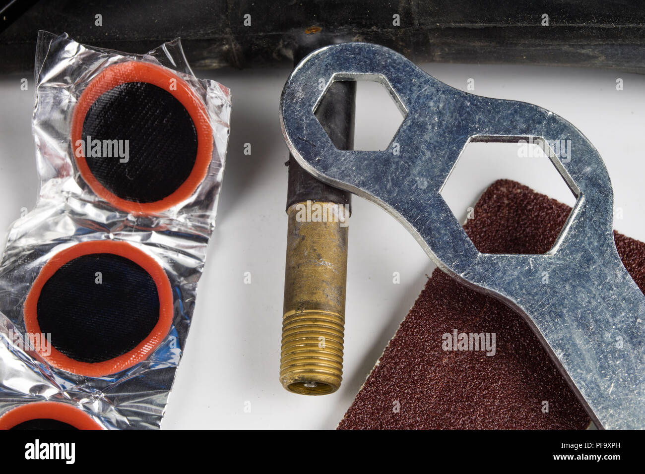 Bicycle tube, glue and patches in the Repairing a damaged