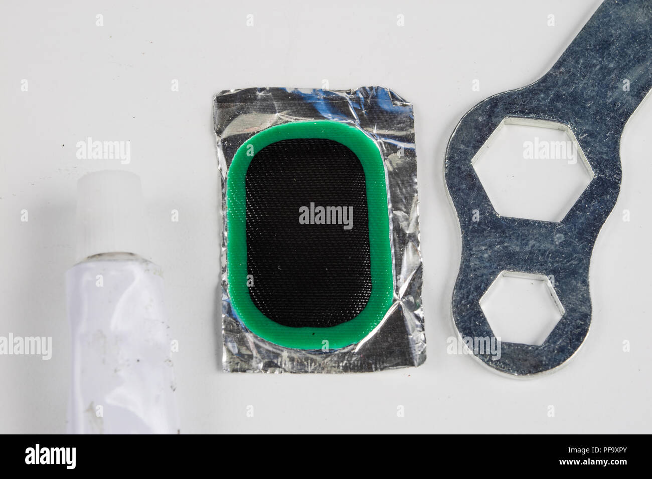 Bicycle tube, glue and patches in the Repairing a damaged