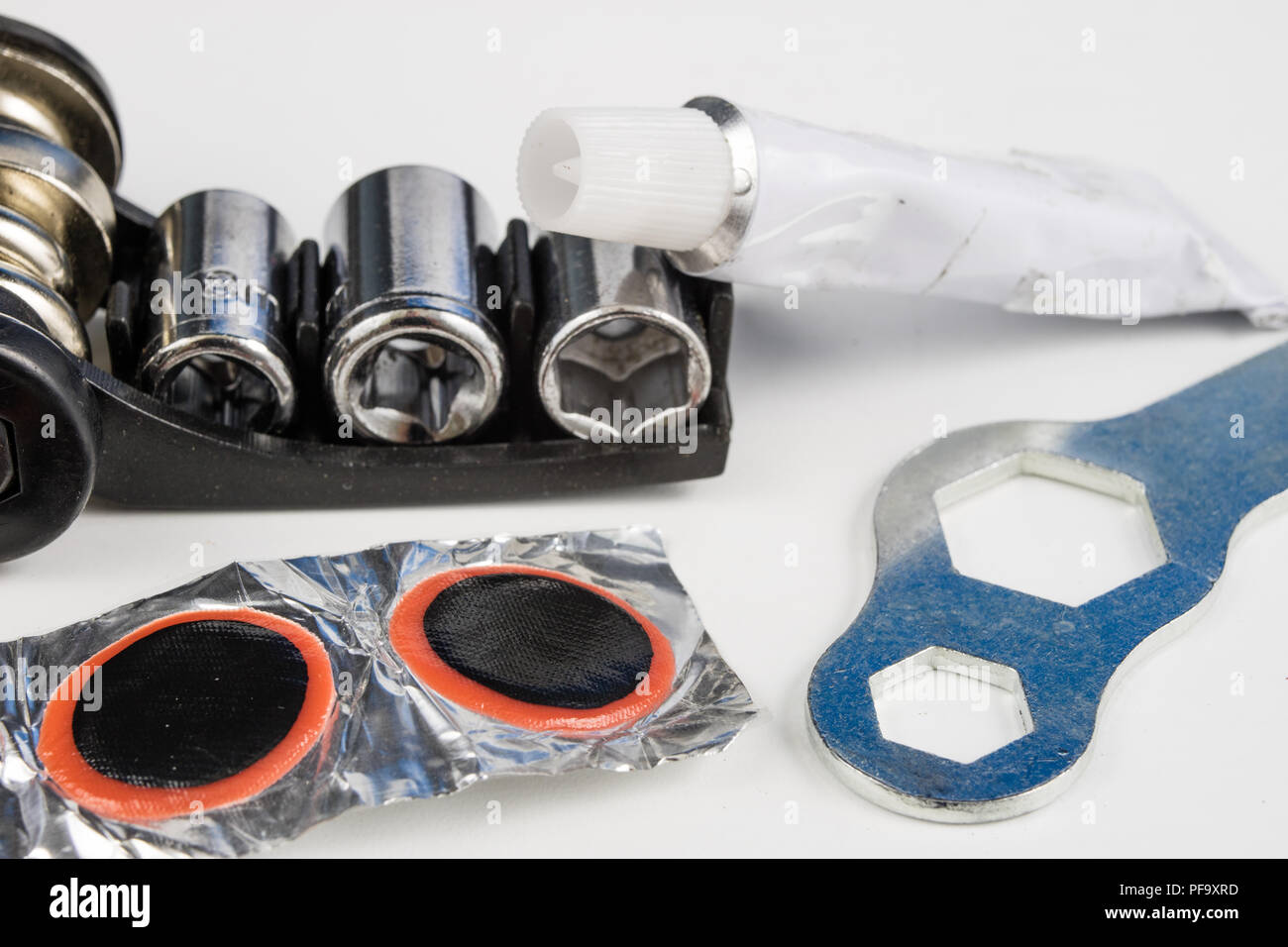 Bicycle tube, glue and patches in the Repairing a damaged