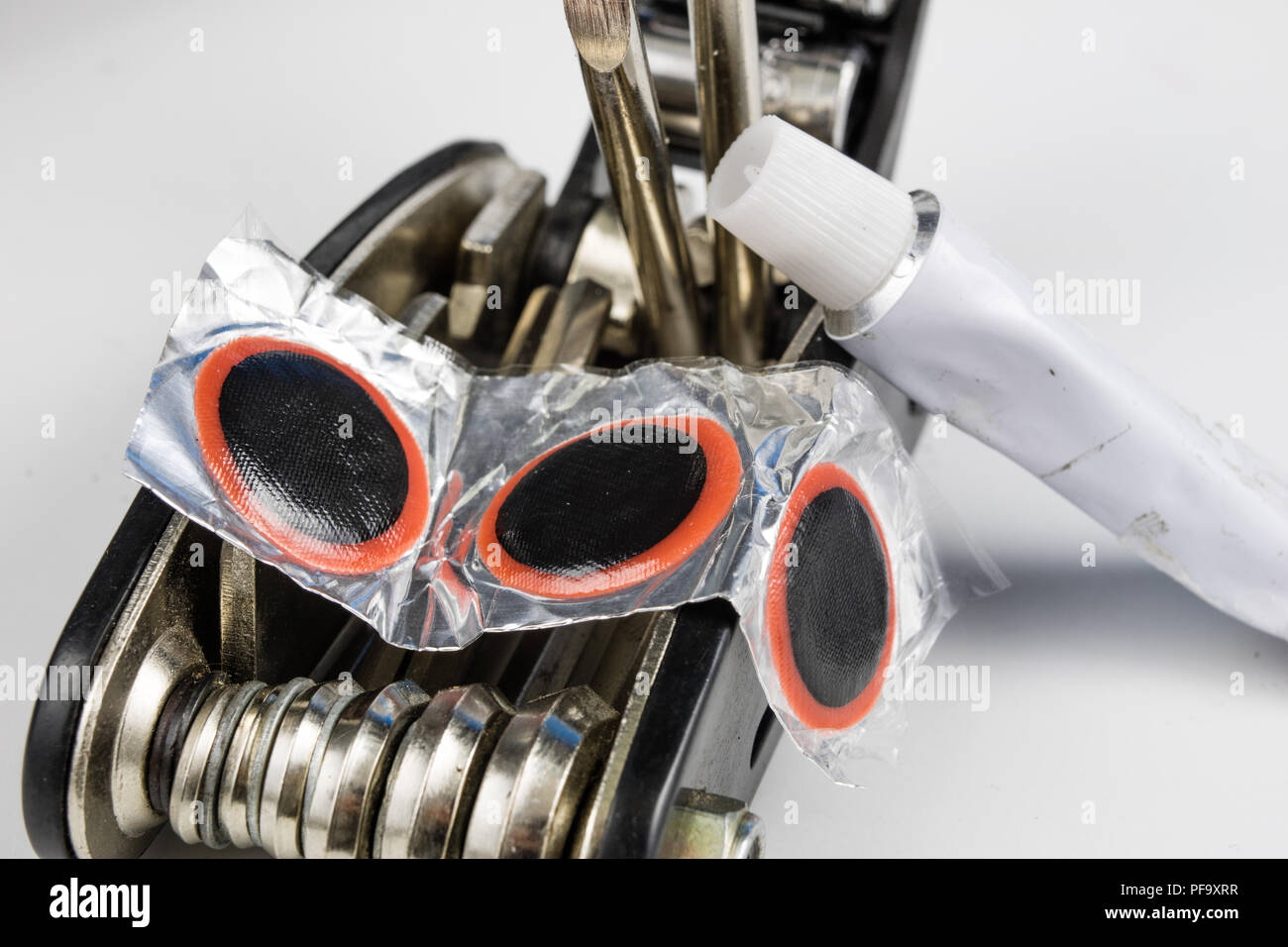 Bicycle tube, glue and patches in the Repairing a damaged