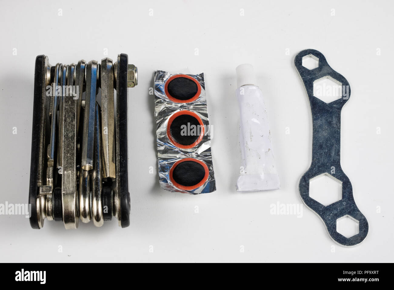 Bicycle tube, glue and patches in the Repairing a damaged