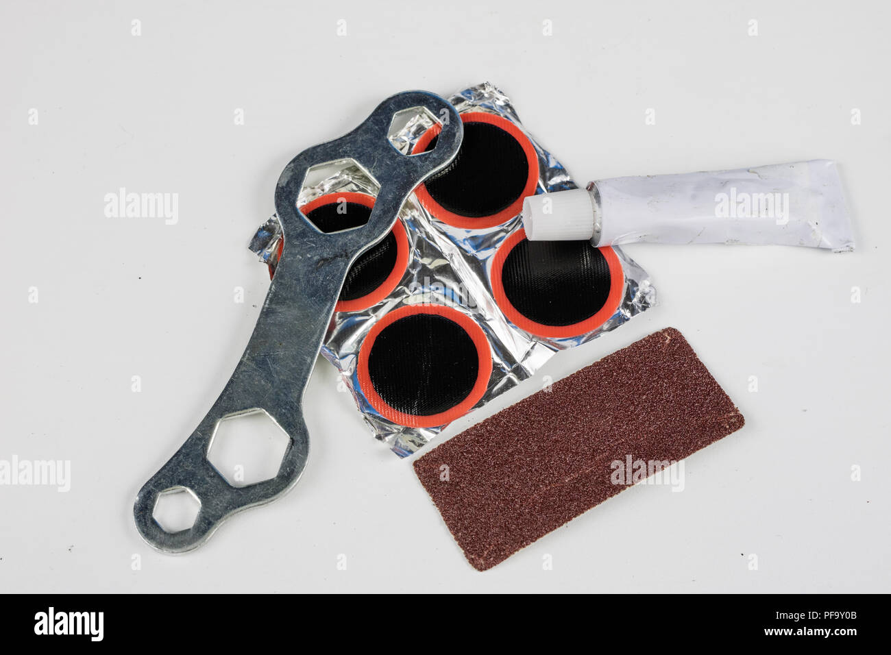 Bicycle tube, glue and patches in the Repairing a damaged