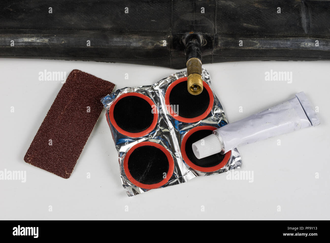 Bicycle tube, glue and patches in the Repairing a damaged