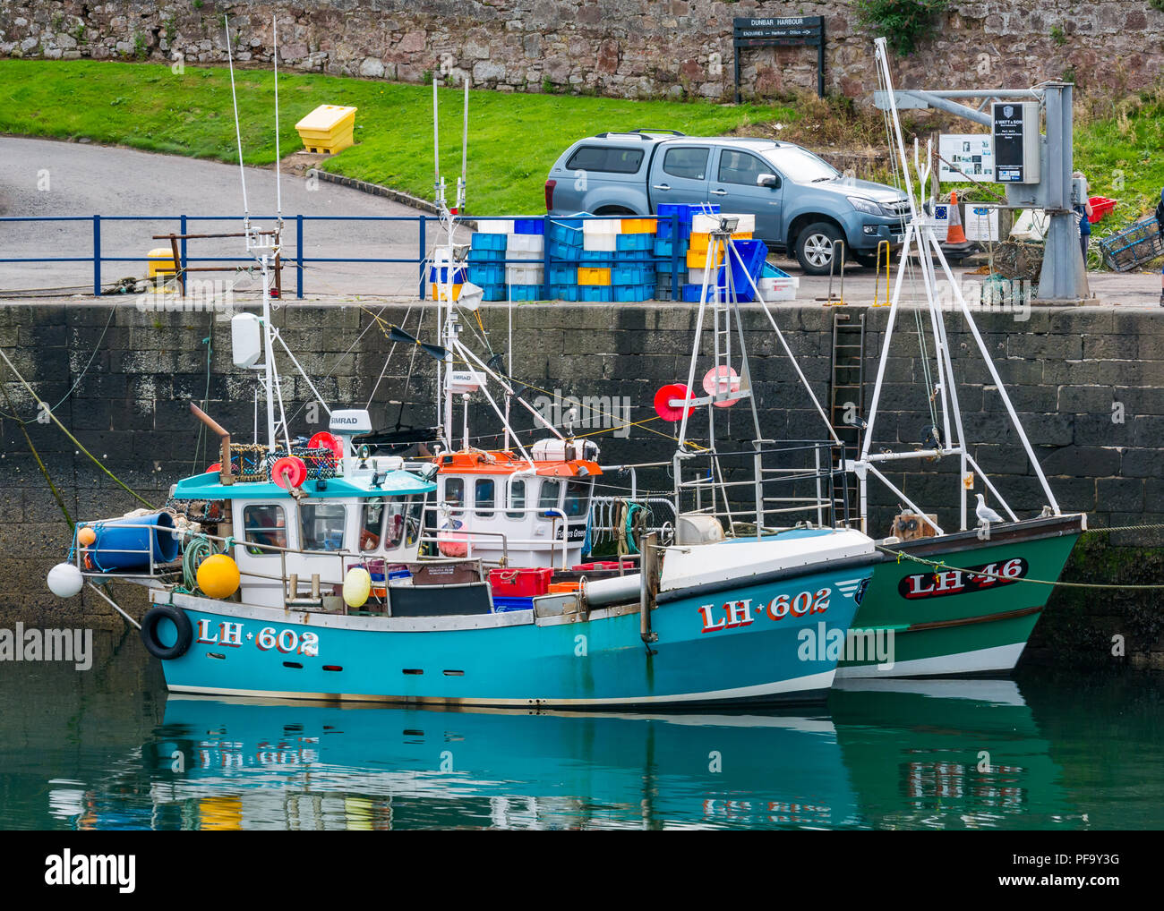 Cp;ourful fishing boats in picturesque harbour, Dunbar, East Lothian