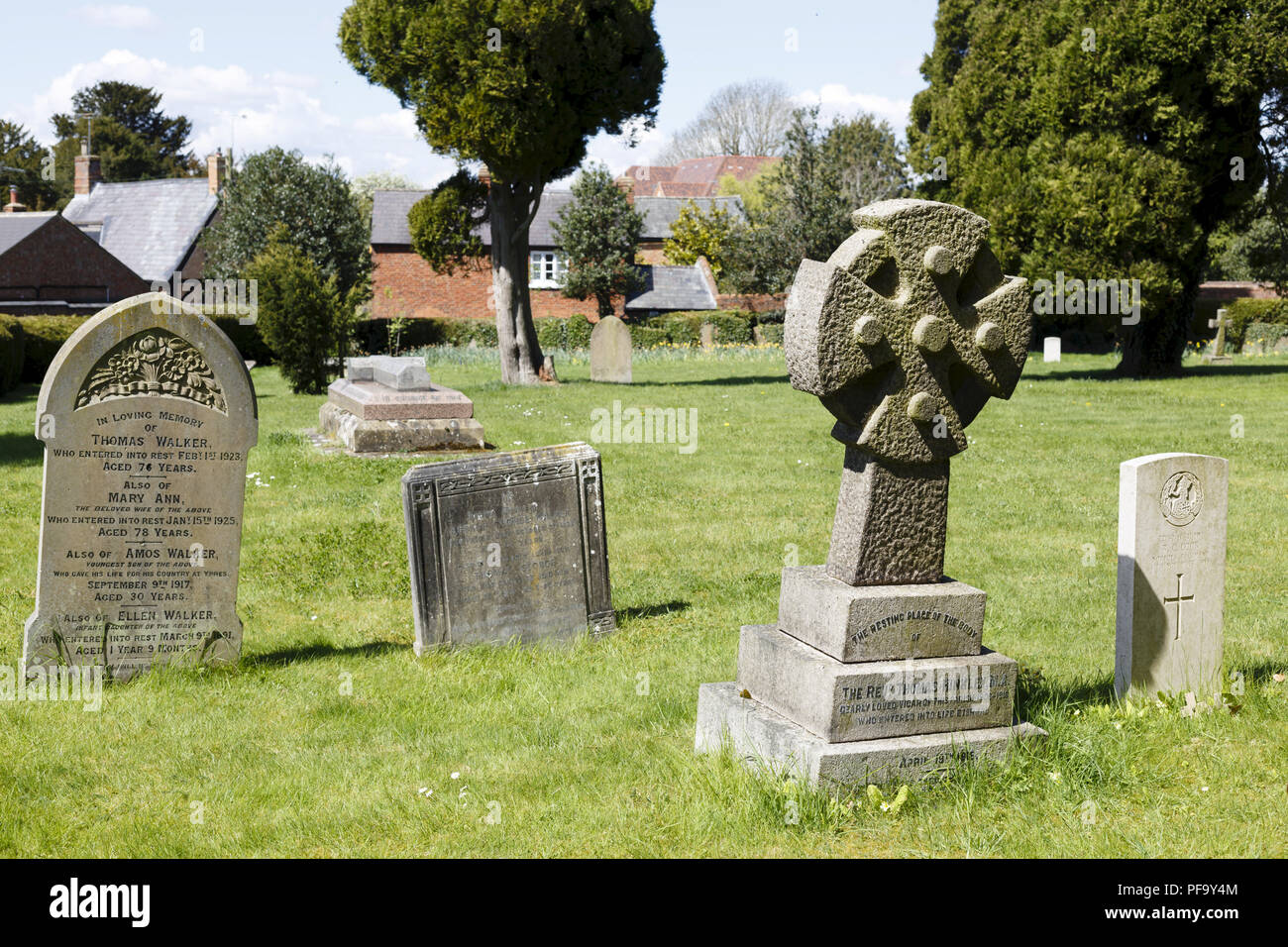 Winslow, UK - April 27, 2015. Old gravestones and headstones in an English graveyard in the historic town of Winslow, Buckinghamshire Stock Photo
