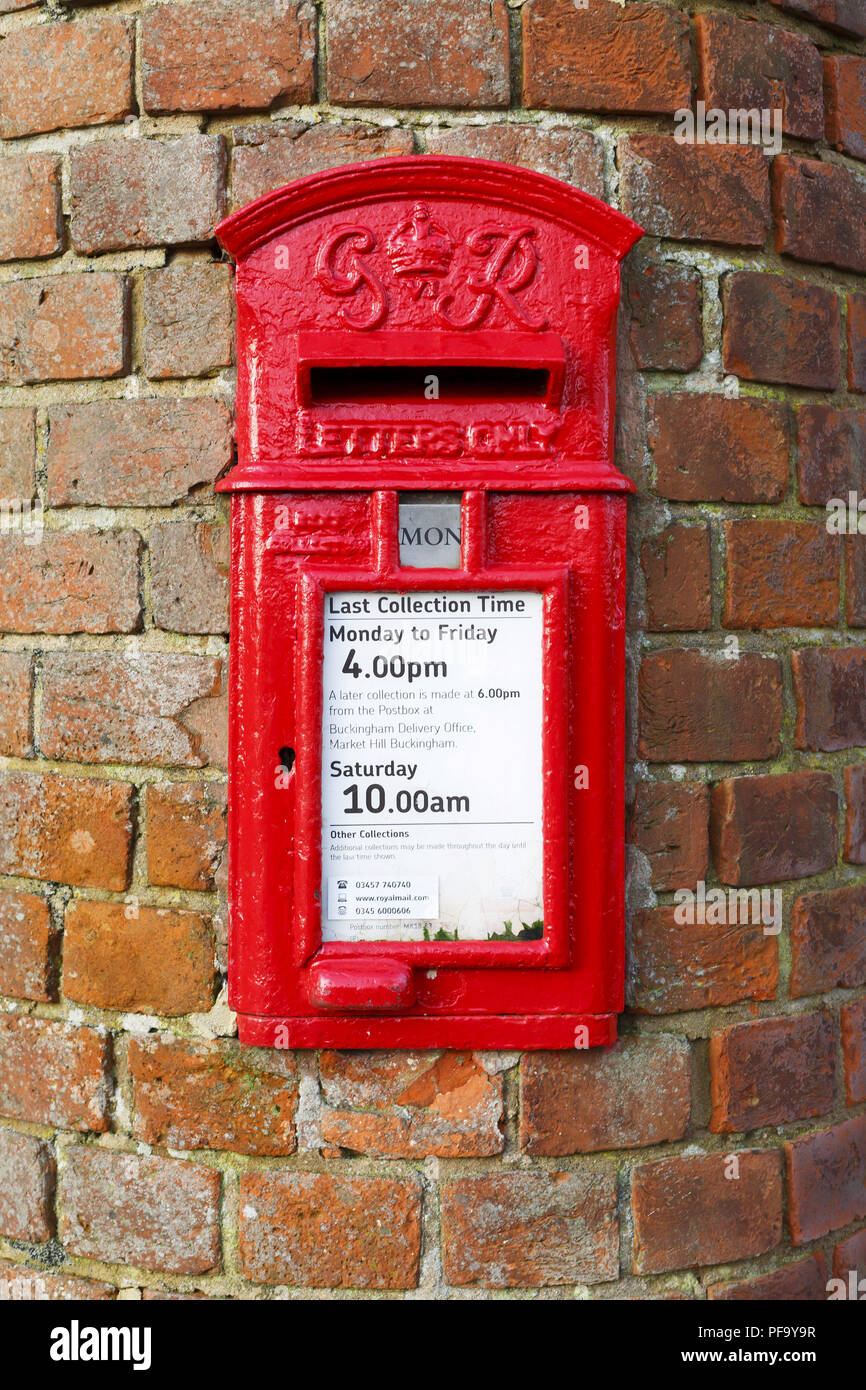 Buckingham, UK - January 16, 2016. A traditional British post box is set into a wall in Buckinghamshire. Stock Photo