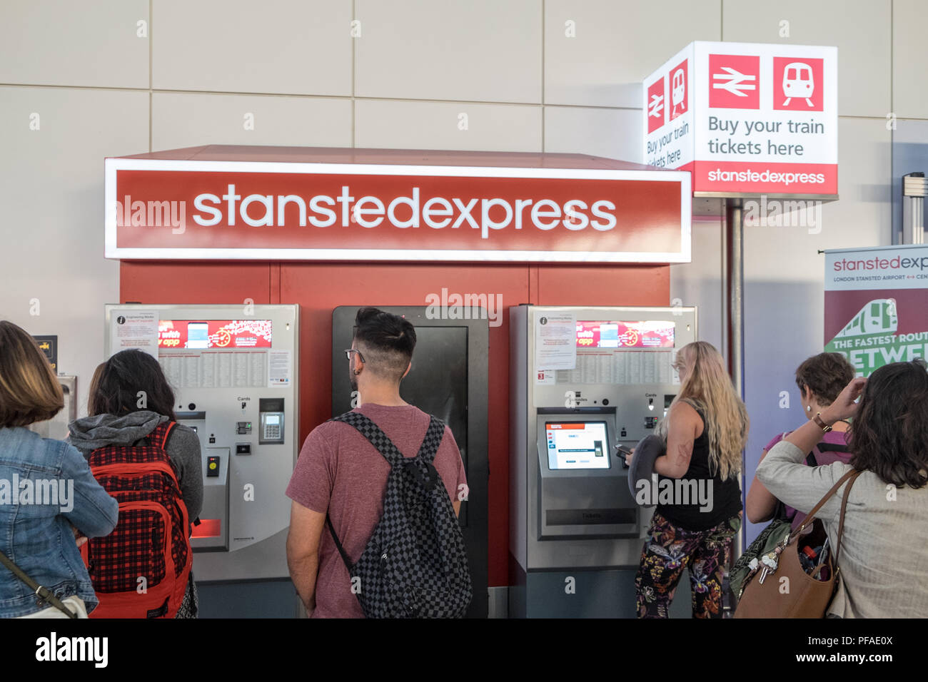 Stansted Express,train,service,ticket,vending,Stansted Airport,arrival,terminal,August,summer,London,Essex,England,Europe,European,passengers,arrival, Stock Photo