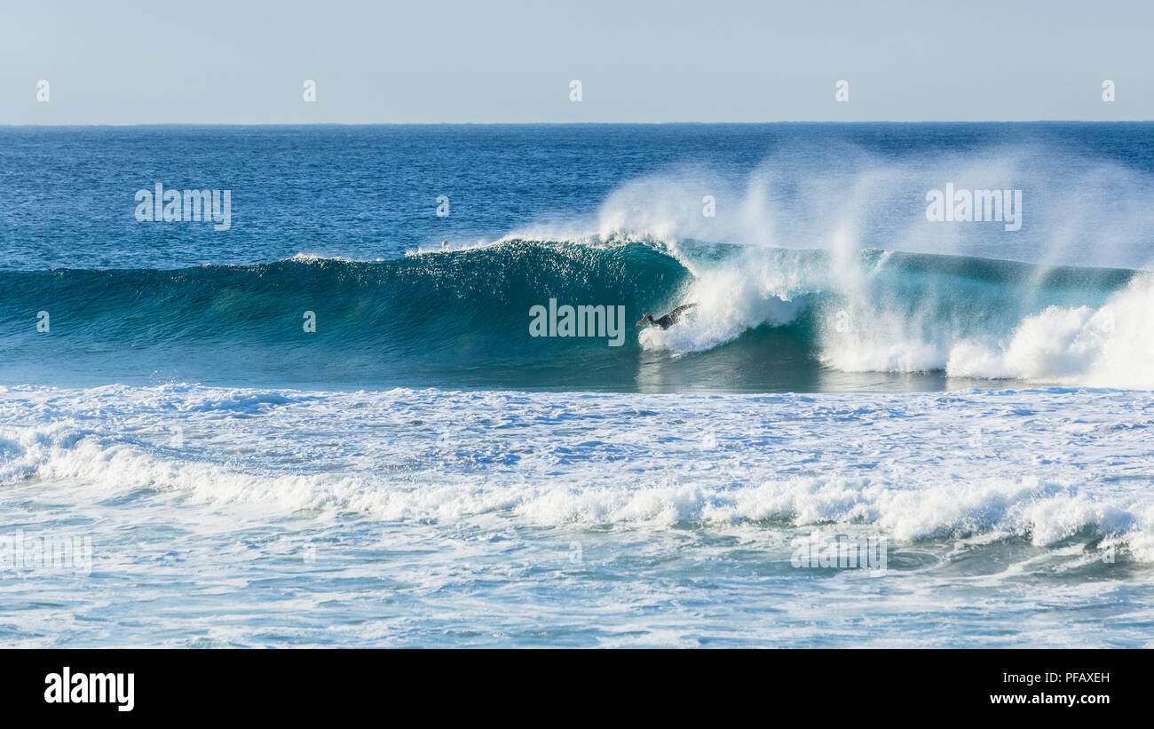 Surfer unidentified head under water falling crashing wipe out attemped ocean wave ride. Stock Photo