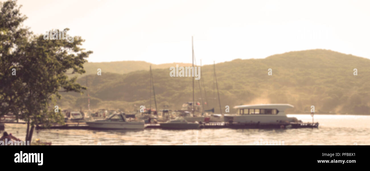 Defocus Banner seascape scenic Bay Marina boats sea and hill horizon. Natural blurred background Stock Photo