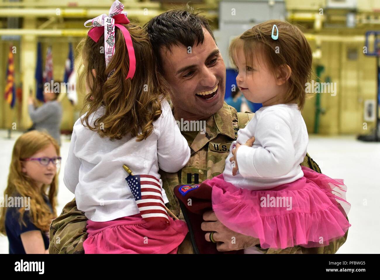 Capt. John Tilley is greeted by his daughters, Frances, 1, and Grace, 3 ...