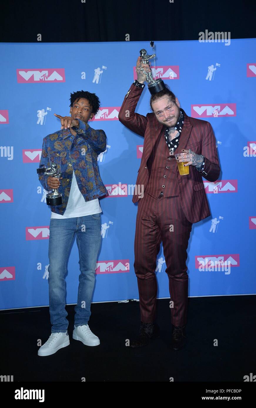 Recording artists 21 Savage (L) and Post Malone appear backstage after  winning the top Rap Song award for 'Rockstar,'' during the 2018 Billboard  Music Awards at MGM Grand Garden Arena on May