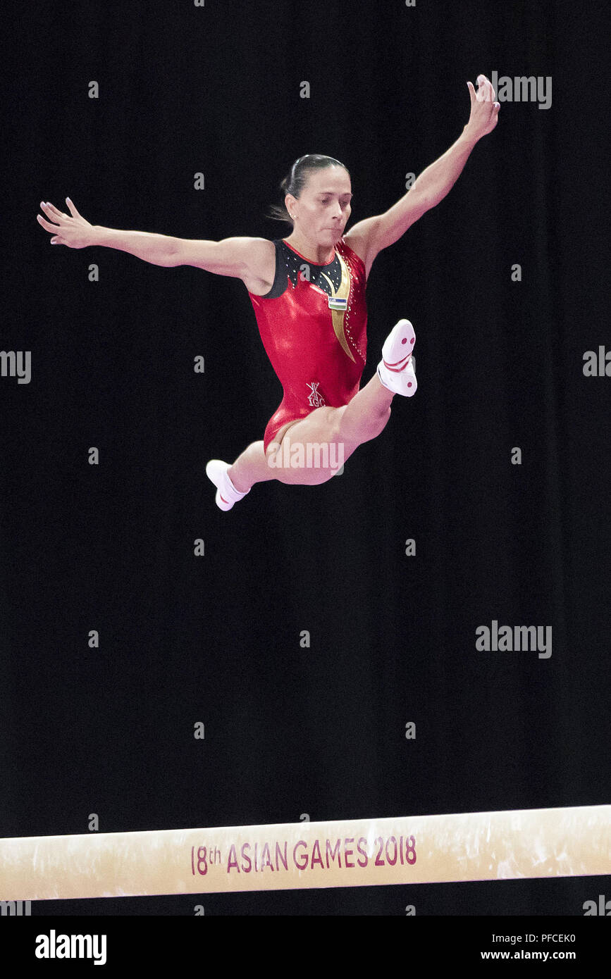 (180821) -- JAKARTA, Aug. 21, 2018 (Xinhua) -- Uzbekistan's Oksana Chusovitina competes during her competition of Artistic Gymnastics at the Asian Games 2018 in Jakarta, Indonesia on Aug. 21, 2018.(Xinhua/Zhu Wei) Stock Photo