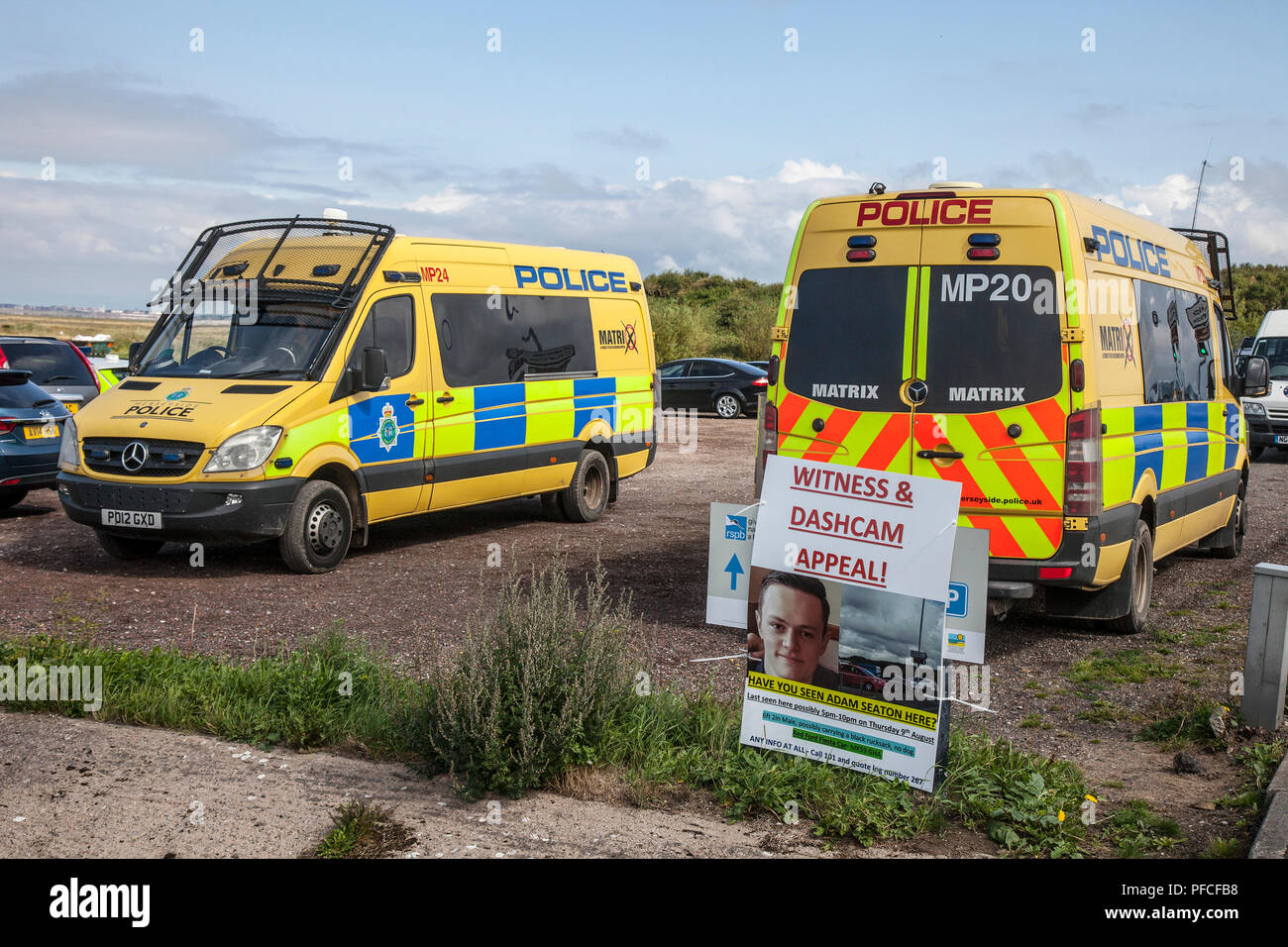 Southport, Merseyside, 21st Aug, 2018. Police search teams, Matrix Police, marine underwater rescue personnel and the coast guard join forces for a major search of the Marshside Ribble Estuary marshes for missing 20 year old Adam Seaton. Officers are appealing for help to trace missing 20-year-old Adam asking drivers who used a Southport car park to study dashcam footage. Adam Seaton went missing on Thursday 9th August, and his car was later found parked near marshland on the seafront promenade. Credit: MediaWorldImages/Alamy Live News Stock Photo