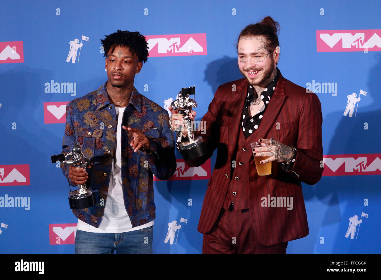 Recording artists 21 Savage (L) and Post Malone appear backstage after  winning the top Rap Song award for 'Rockstar,'' during the 2018 Billboard  Music Awards at MGM Grand Garden Arena on May