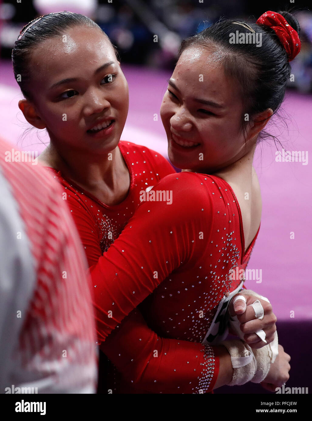 Jakarta. 21st Aug, 2018. Chen Yile (L)of China celebrates with her ...