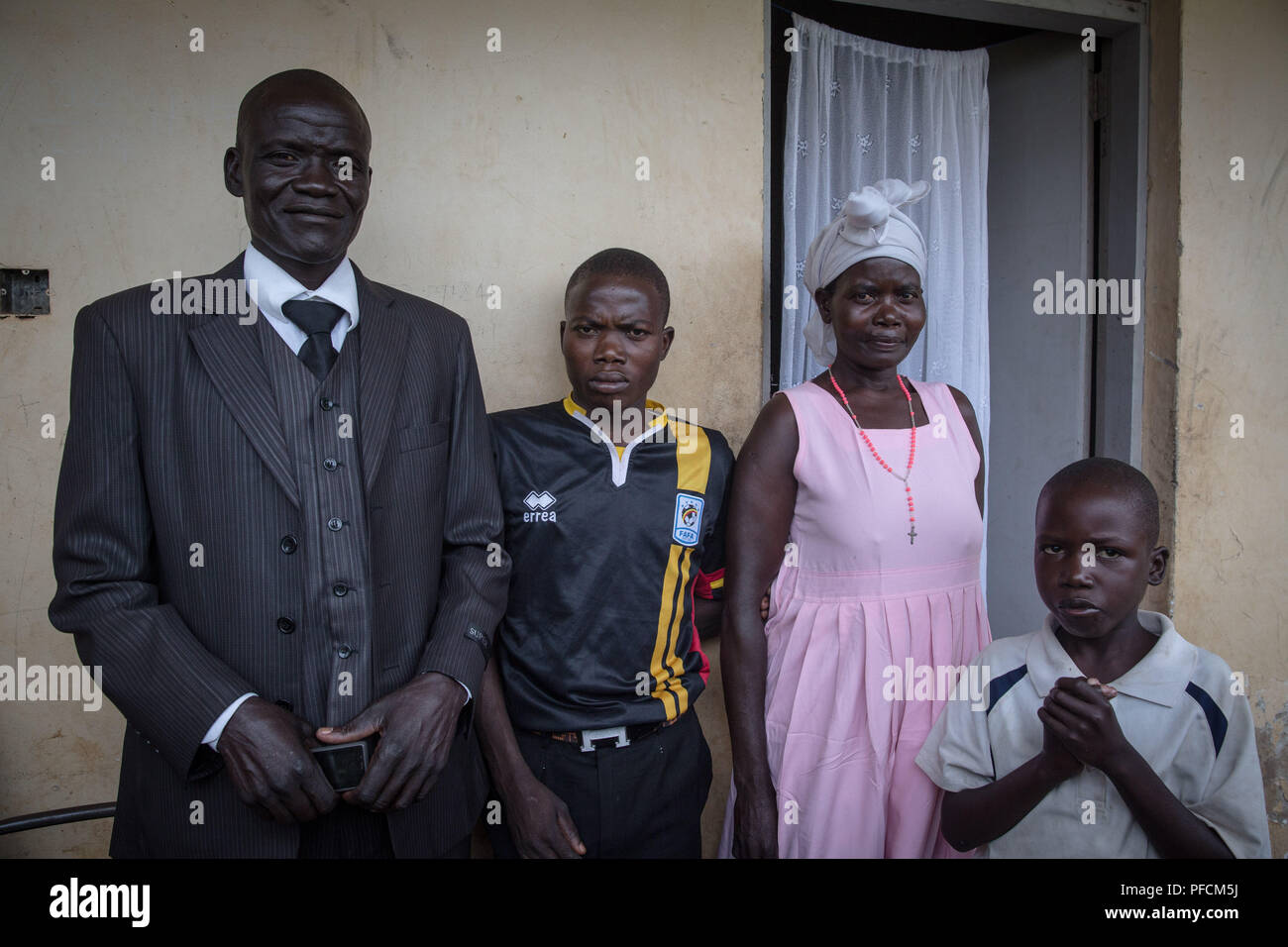 Gulu, Gulu, Uganda. 16th July, 2018. Stephen Okot, 32, seen with his family.The reunion between three escapees and their families, who hadn't seen them in sixteen years. These were abducted when kids by the Lord's Resistance Army, a rebel group that terrorized northern Uganda. Credit: Sally Hayden/SOPA Images/ZUMA Wire/Alamy Live News Stock Photo