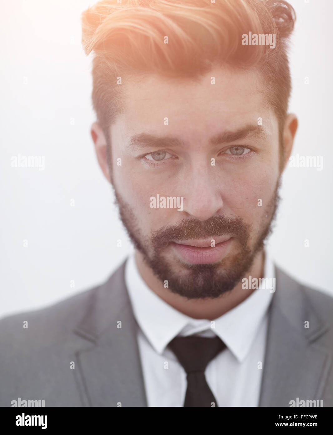 Serious businessman wearing suit and tie. blue background Stock Photo ...