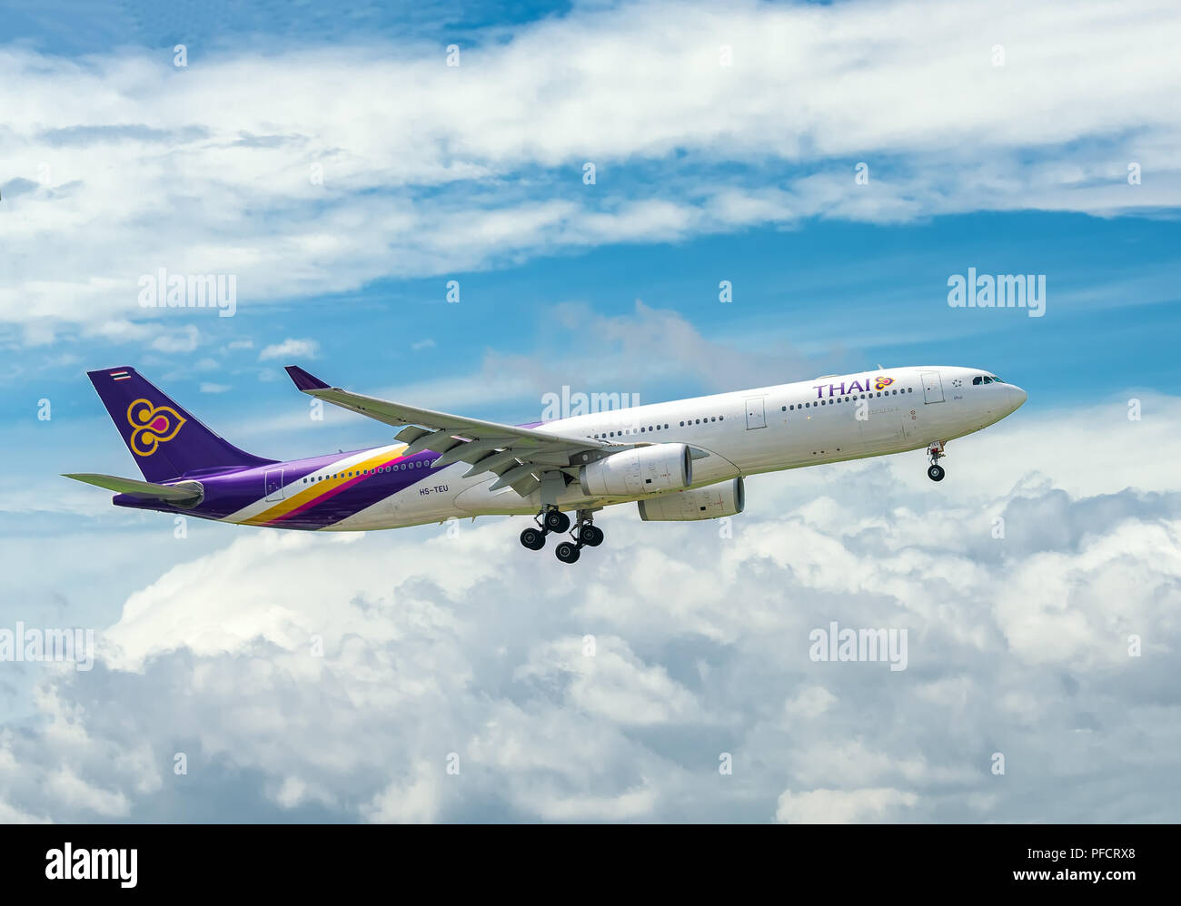 Passenger aircraft airbus A330 of Thai Airways fly in sky prepare to landing at Tan Son Nhat International Airport Stock Photo